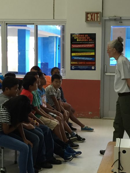 Fields Falcone discussing native birds with local school kids.